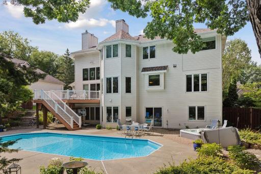 Heated pool, hot tub, and composite deck create an ideal entertainment space. The wood fence provides privacy for birthdays, gatherings, and summer fun!