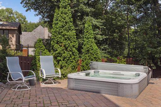 Enjoy year round relaxation in the cozy hot tub area!