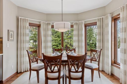 Enjoy your morning coffee in the sun-kissed breakfast nook, featuring bay windows overlooking the stunning backyard! (Please note curtains are not included)