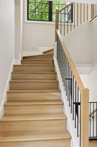 Exquisitely rebuilt staircase from main to upper level