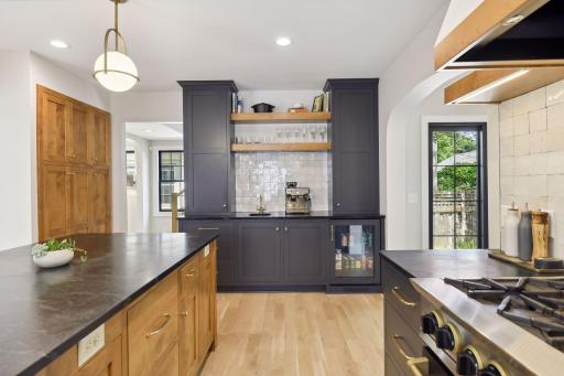 Built in pantry, coffee bar, beverage fridge and sink