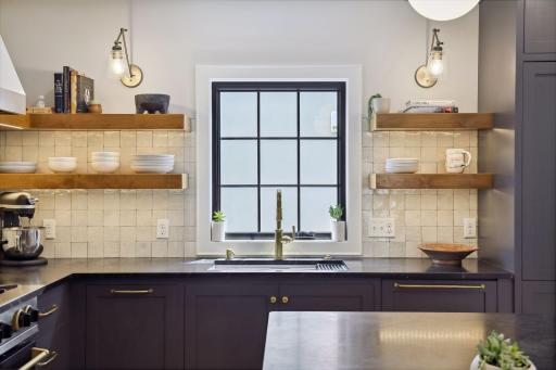 BlueStar Cooking Range, Alder wood center island with soapstone countertop, Moroccan zellige tile backsplash, unlacquered brass hardware