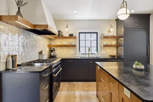 BlueStar Cooking Range, Alder wood center island with soapstone countertop, Moroccan zellige tile backsplash, unlacquered brass hardware, white oak floors