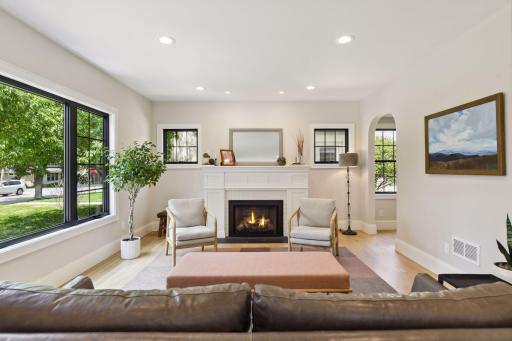 Bright and sunny living room with gas fireplace