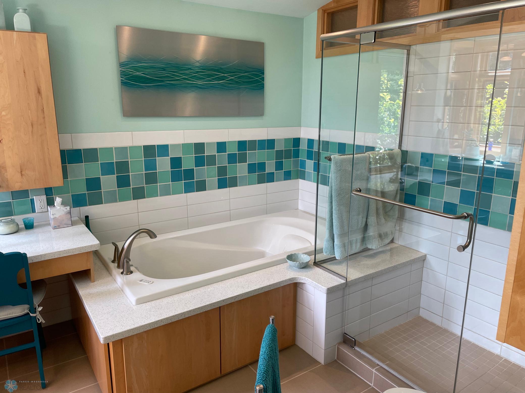 Master bath - view to jetted tub and glass shower enclosure.jpg