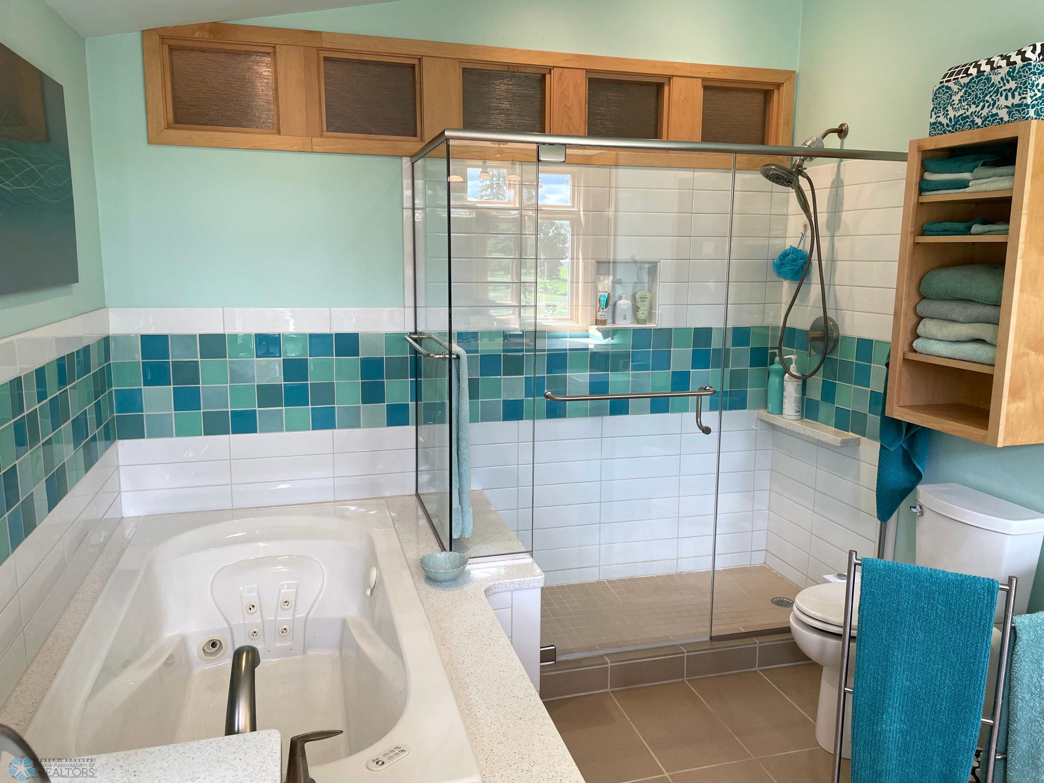 Master bath - jetted tub view to glass shower enclosure.jpg