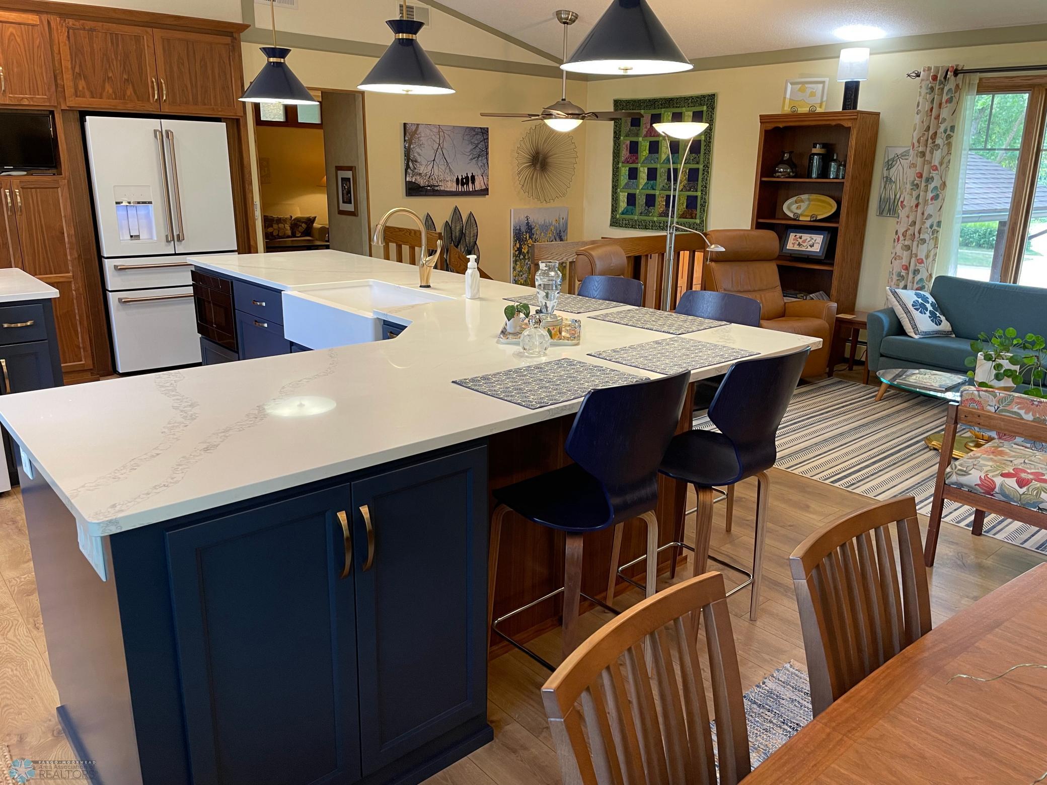 Dining area view to kitchen, stairs, and upper level family room:den entryway.jpg