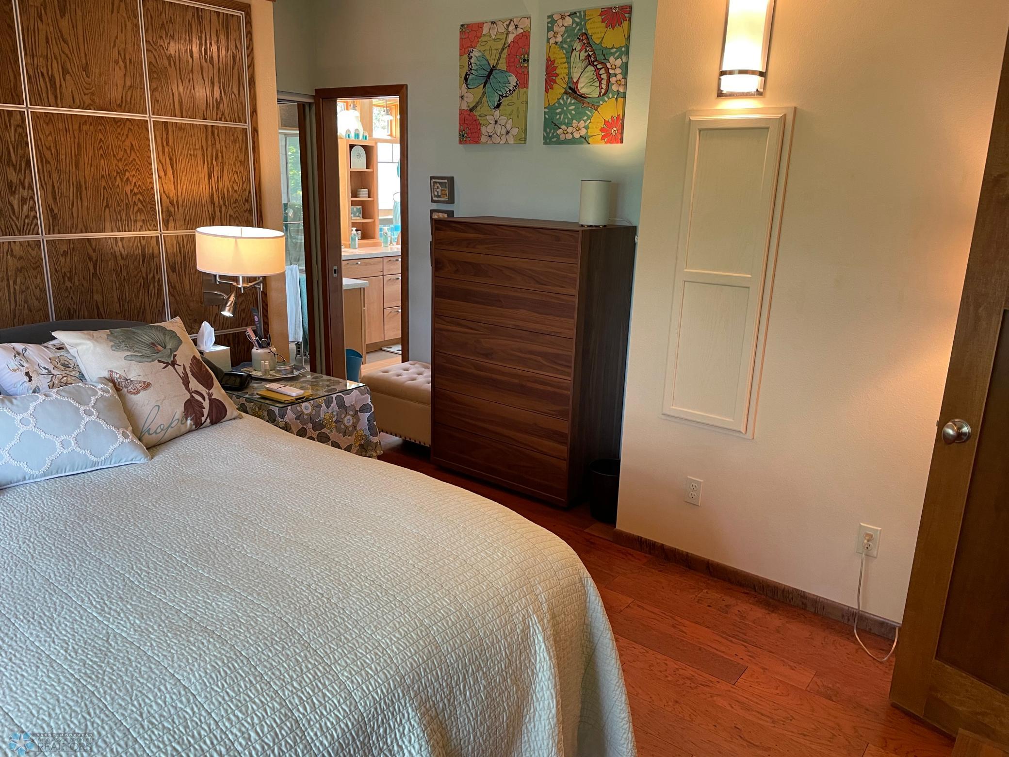 Vaulted master bedroom - view toward master bath and built-in ironing board.jpg
