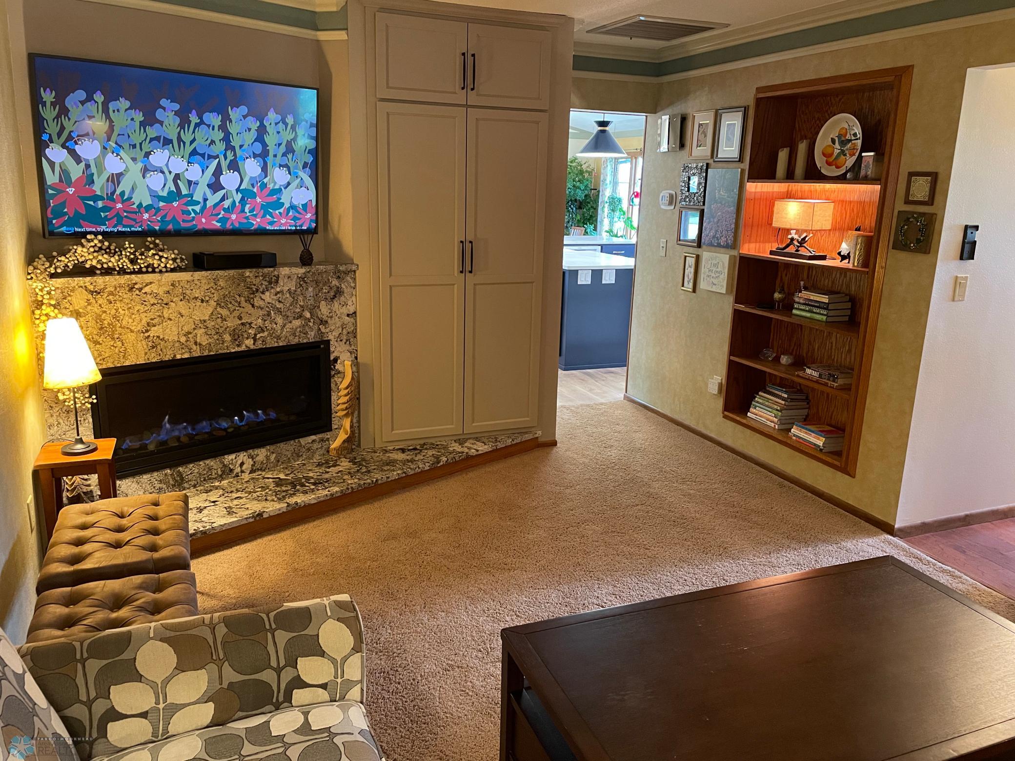 Upper level family room : den - gas fireplace with granite hearth and surround - Reverse view toward kitchen.jpg