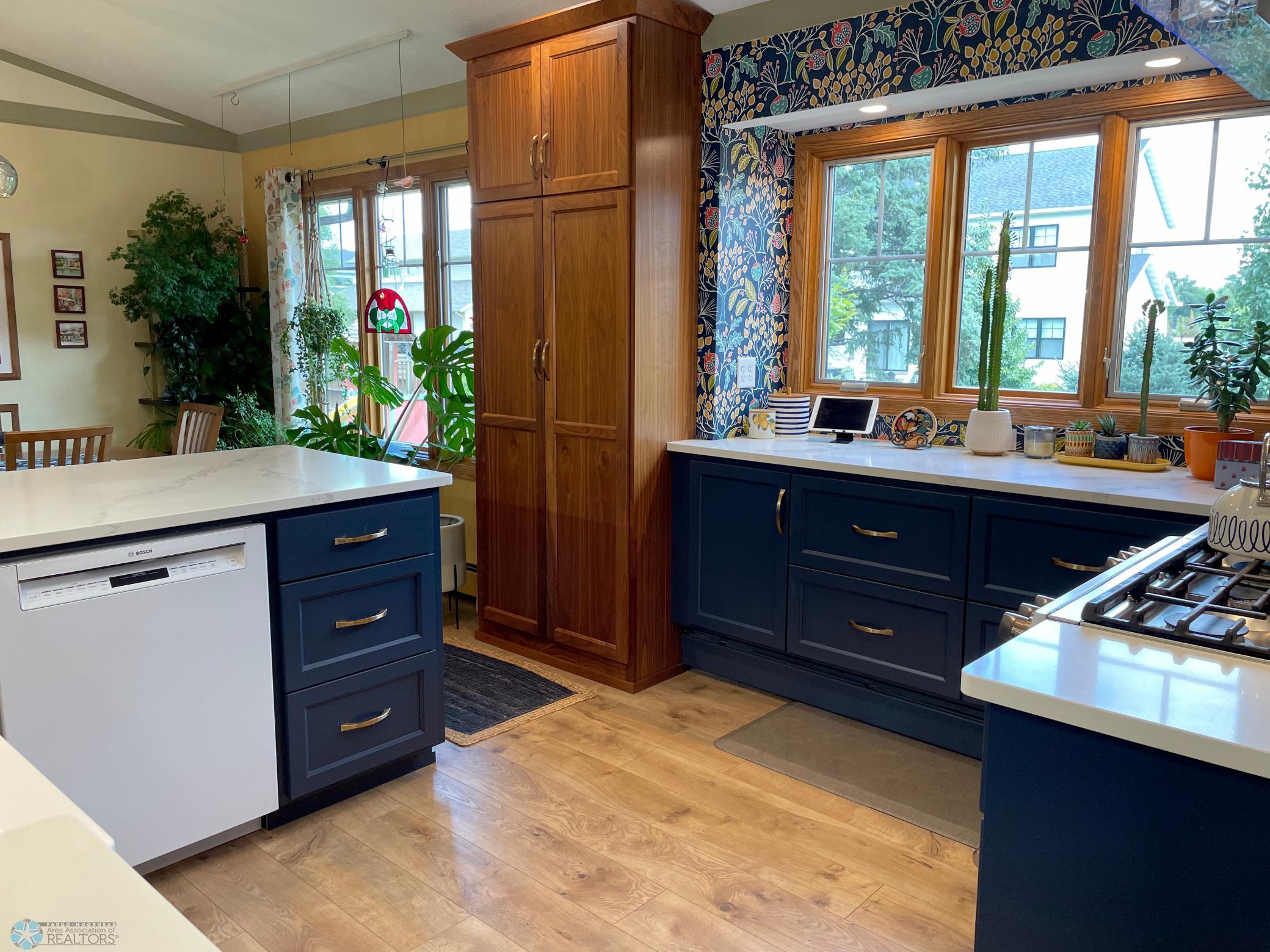 Kitchen - view to tall pantry cabinet and dining area.jpg