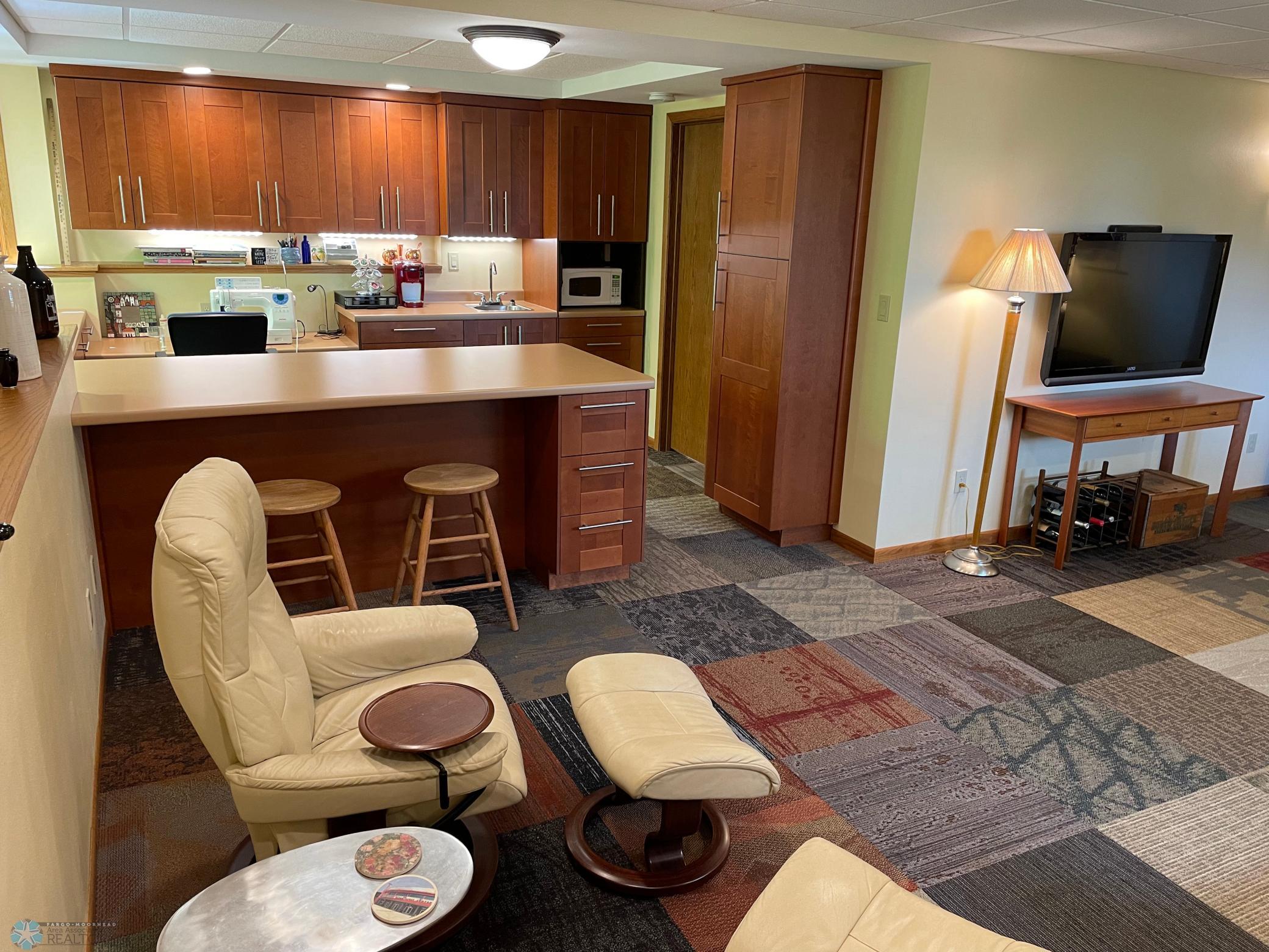 Family room on lower level - view to hobby area:kitchenette.jpg