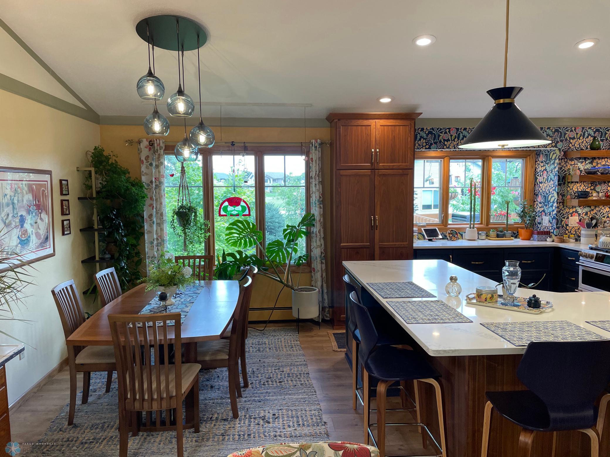 Vaulted dining area and large kietchen breakfast bar - view from living room.jpg