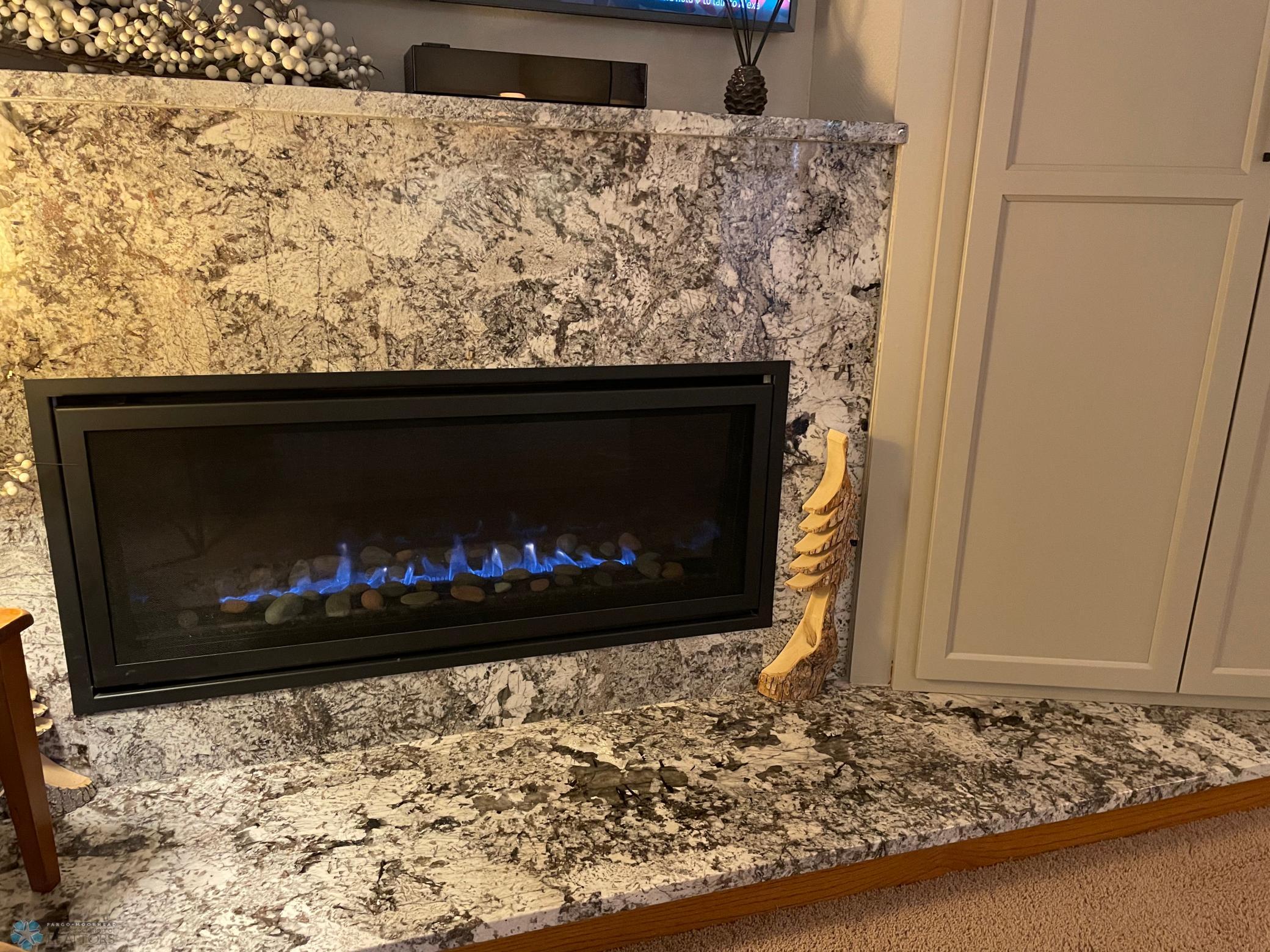 Upper level family room : den - gas fireplace with granite hearth and surround.jpg