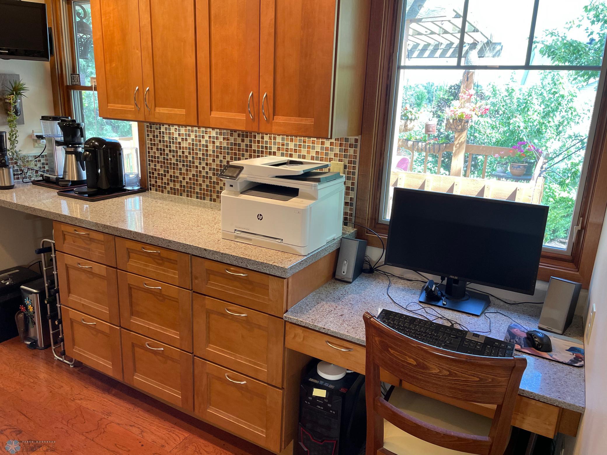 Office area next to kitchen with wet bar and cabinets - reverse view.jpg