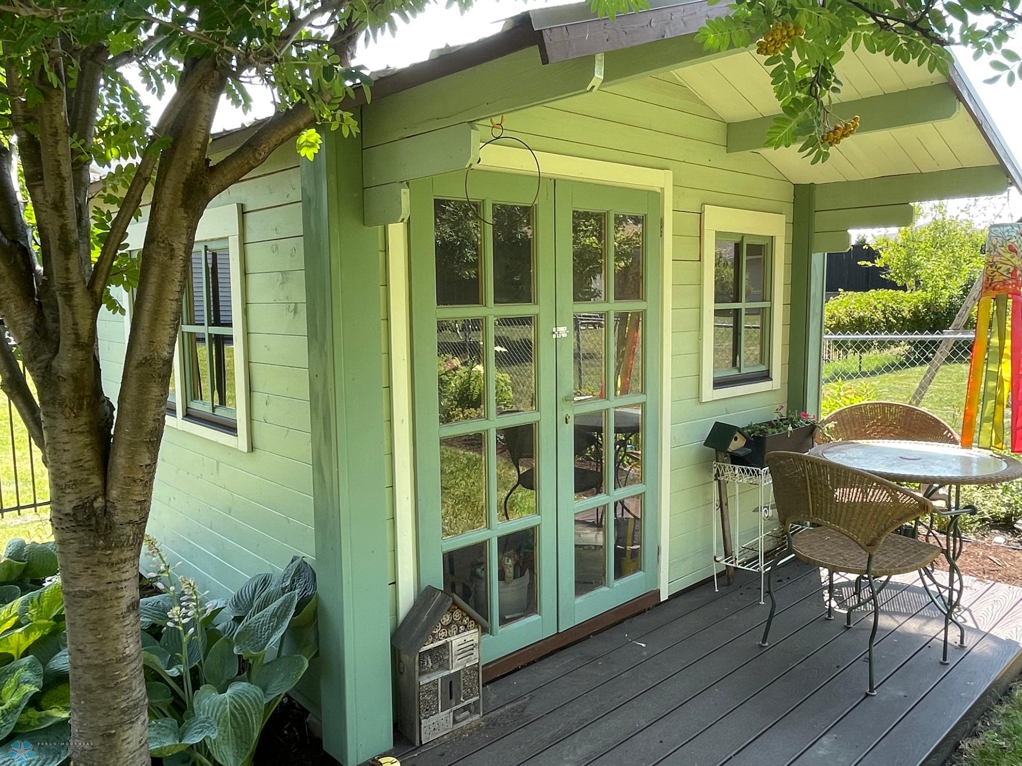 Backyard - decorative yard shed with French doors.jpg