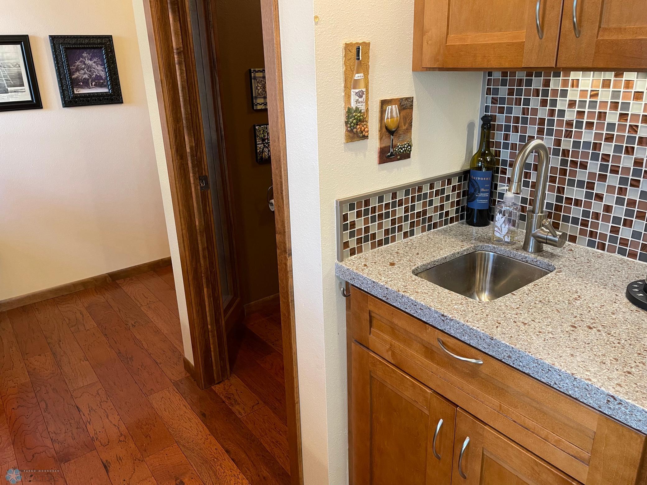 Office area next to kitchen view to wet bar and guest half bath-.jpg
