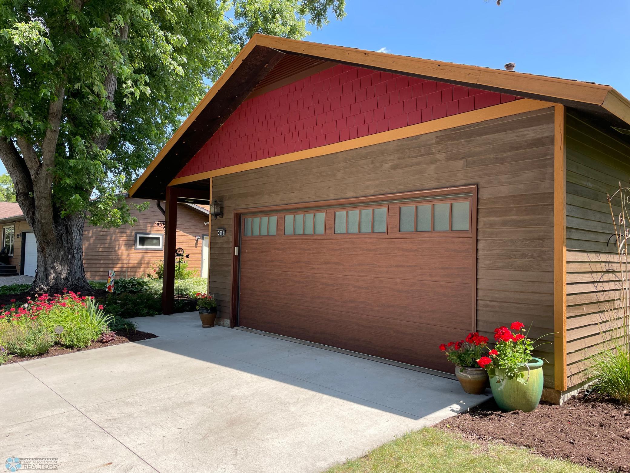 Exterior - front of the 22' x 22' double attached garage with steel overhead door with windows.jpg