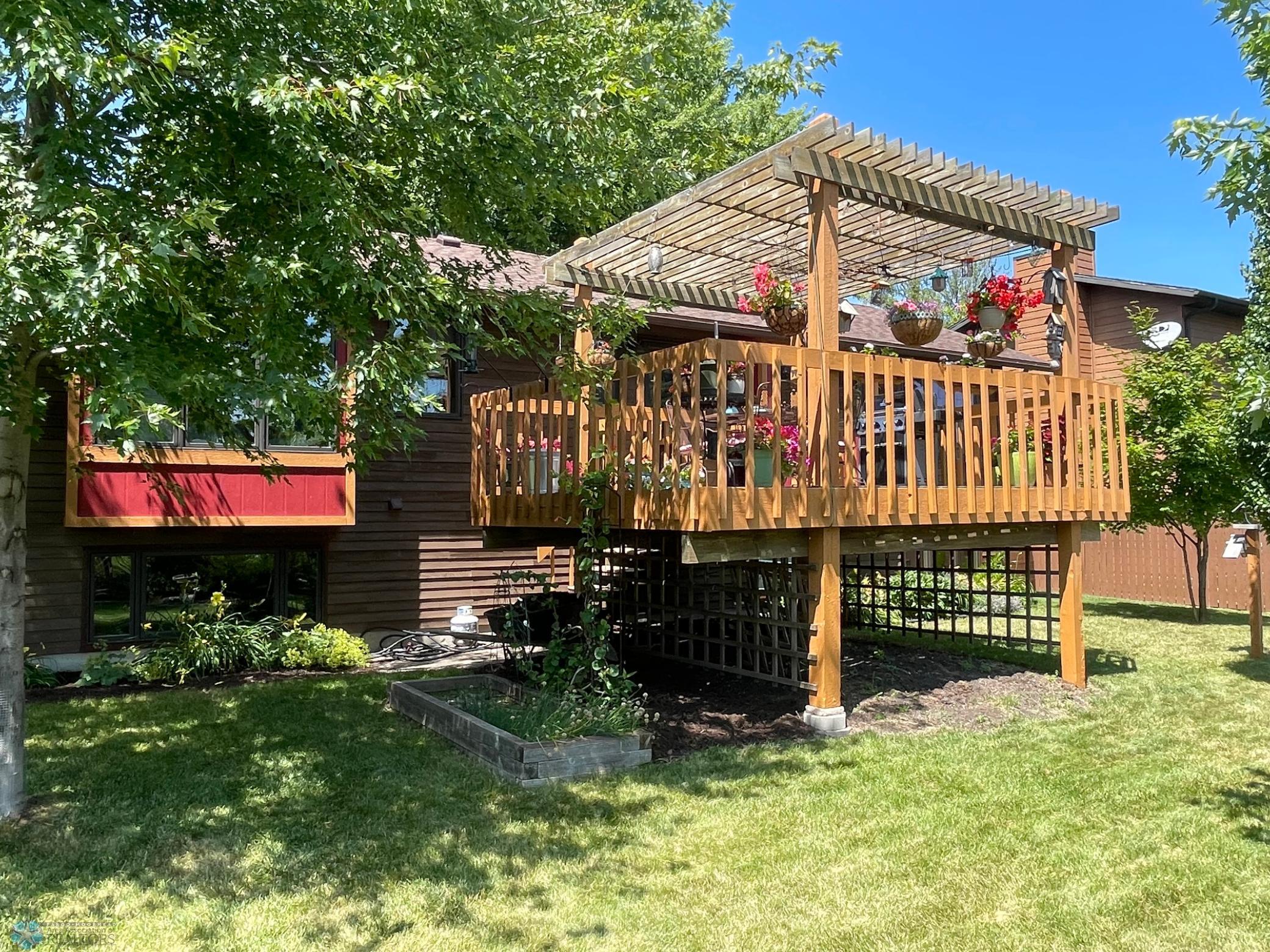 Backyard view to 16' x 12.5' deck with trellis.jpg
