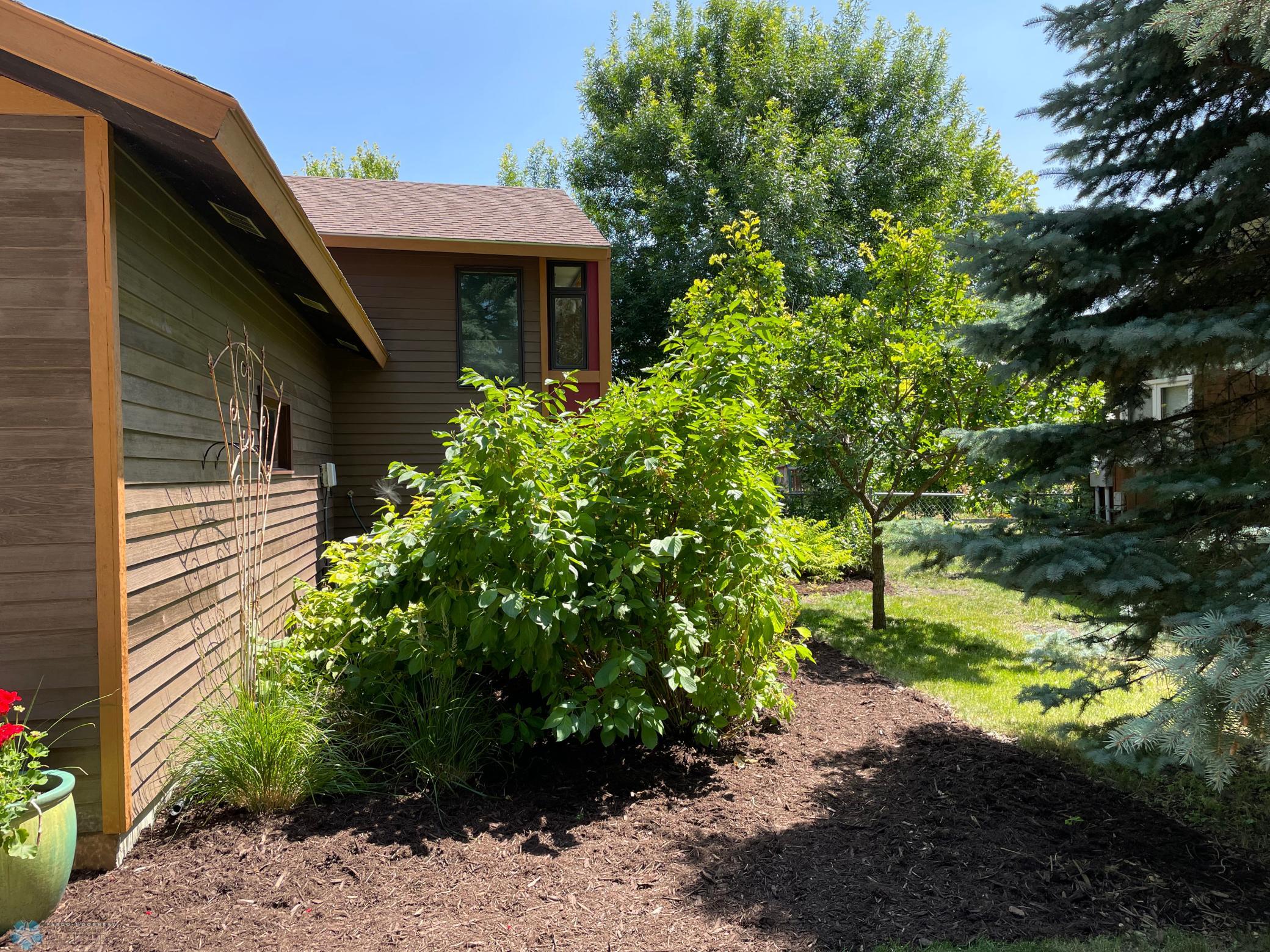 Side yard on right side of the home with the addition in view.jpg