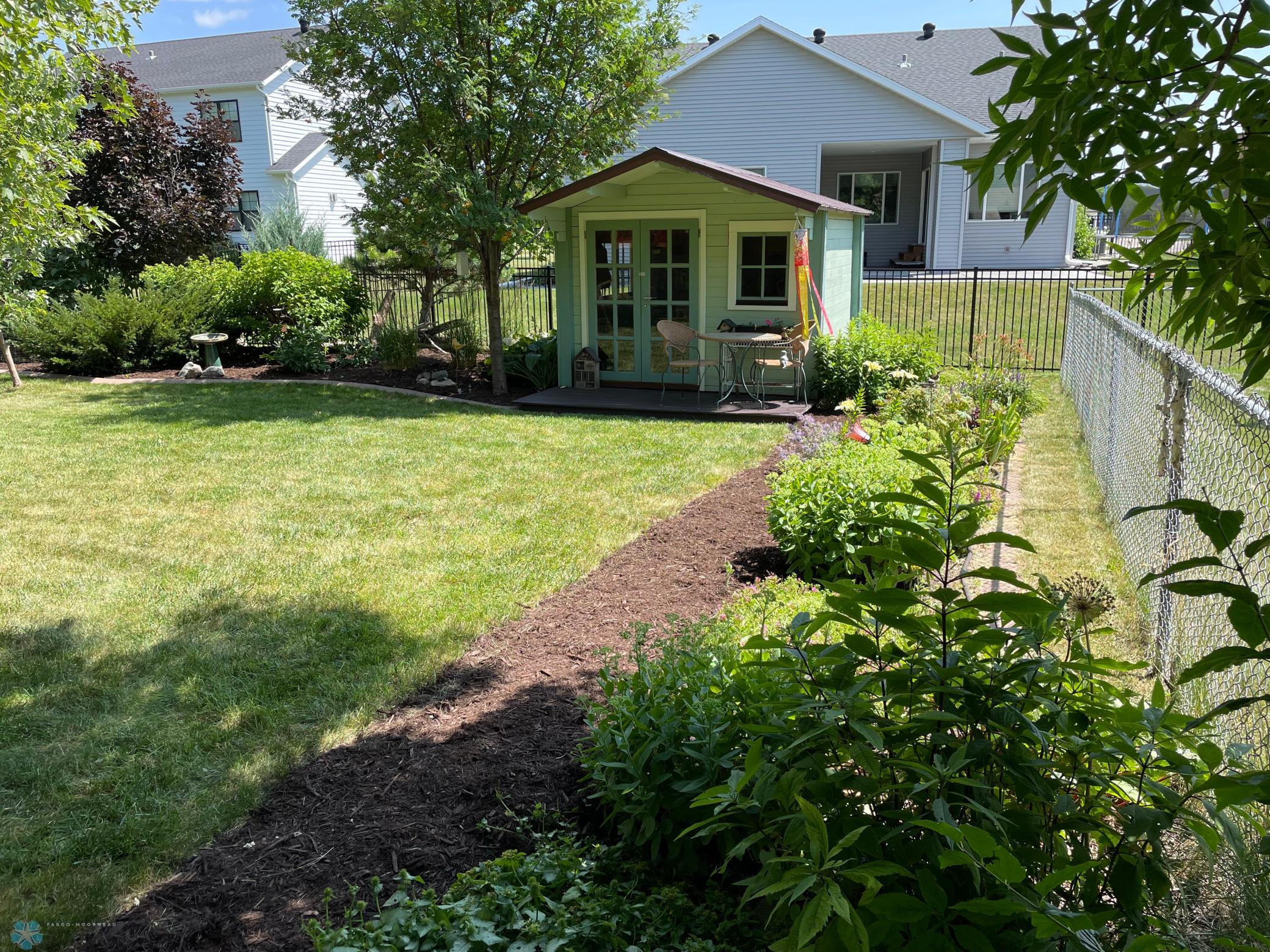 Backyard right side - view from side yard to decorative shed.jpg