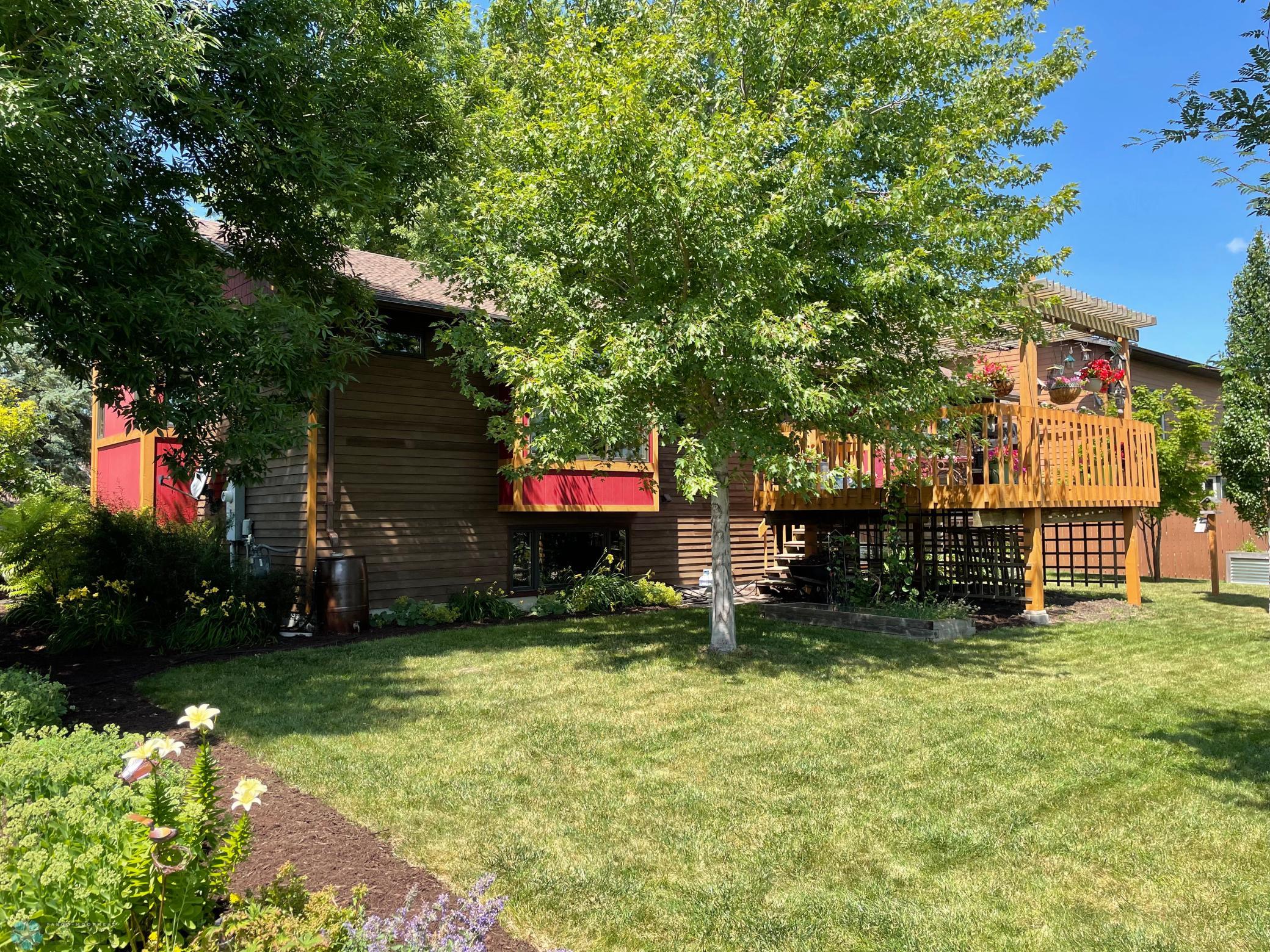 Exterior - view from back yard to the home from corner with decorative shed.jpg