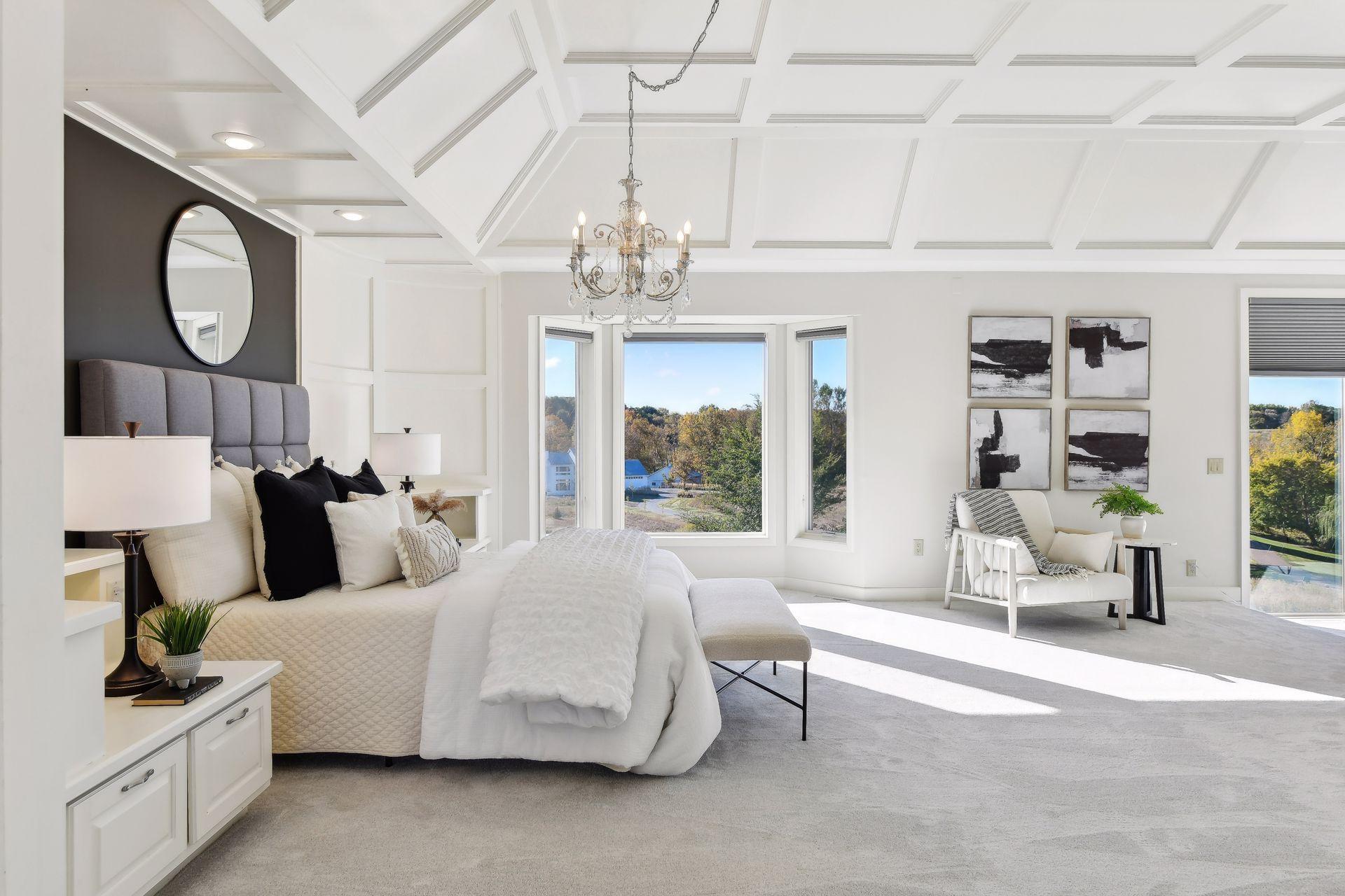 The luxurious primary suite showcases a sitting area with fireplace, home office, lavish bathroom, and spacious walk-in closet.