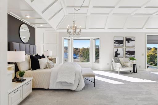 The luxurious primary suite showcases a sitting area with fireplace, home office, lavish bathroom, and spacious walk-in closet.