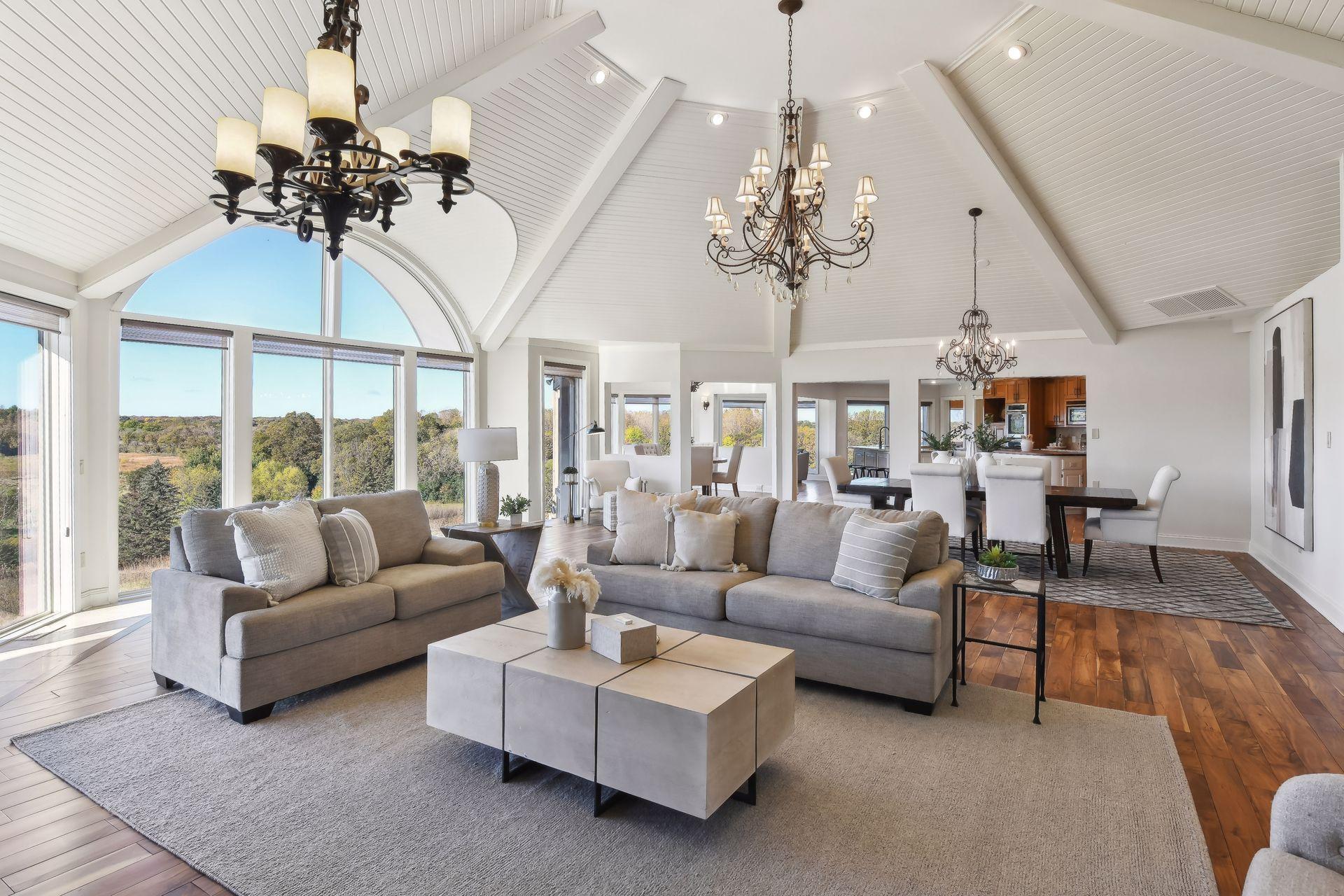 The great room is flanked by causal living spaces coupled with elegant rooms designed for entertaining.