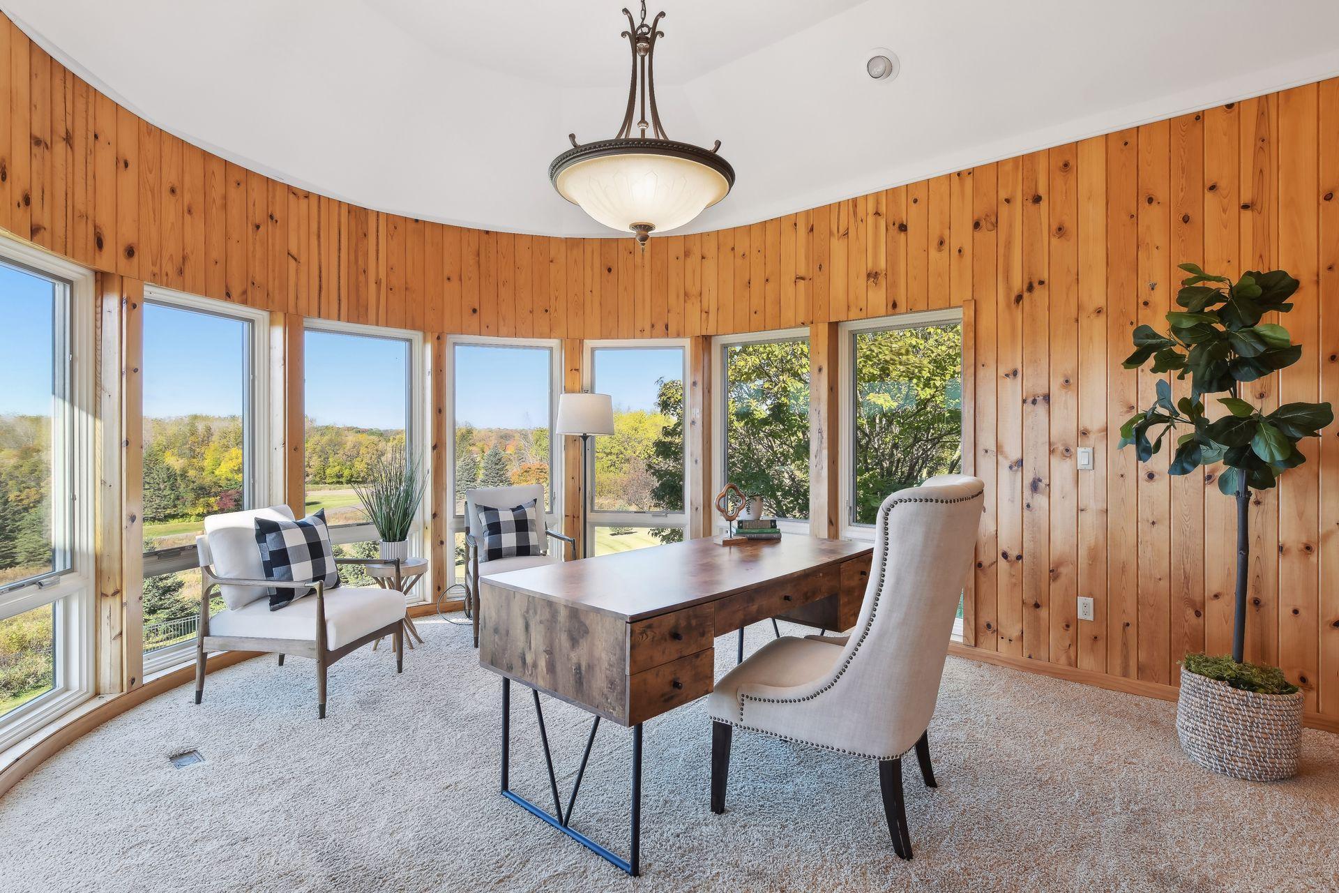 The main floor offers a gourmet kitchen, sunroom, and laundry.