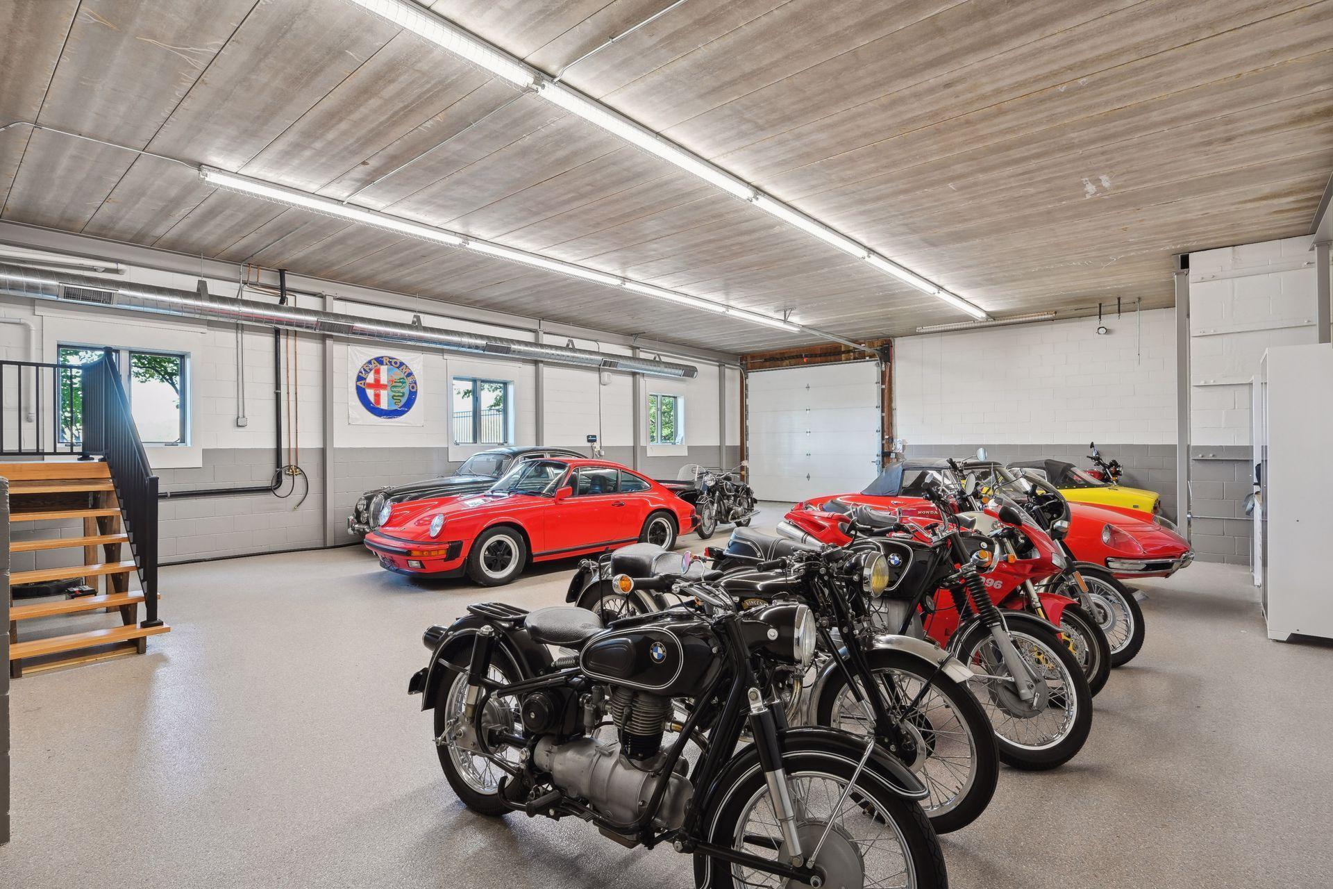 Car and boat enthusiasts will be delighted by the main level four-car heated garage and impressive 1,176 finished square feet in the heated lower garage, offering ample space to showcase your collection.