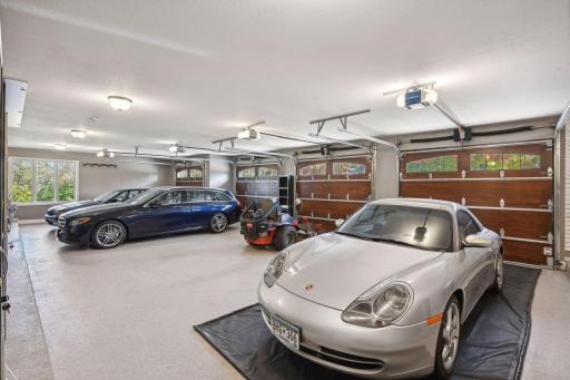 Car and boat enthusiasts will be delighted by the main level four-car heated garage and impressive 1,176 finished square feet in the heated lower garage, offering ample space to showcase your collection.
