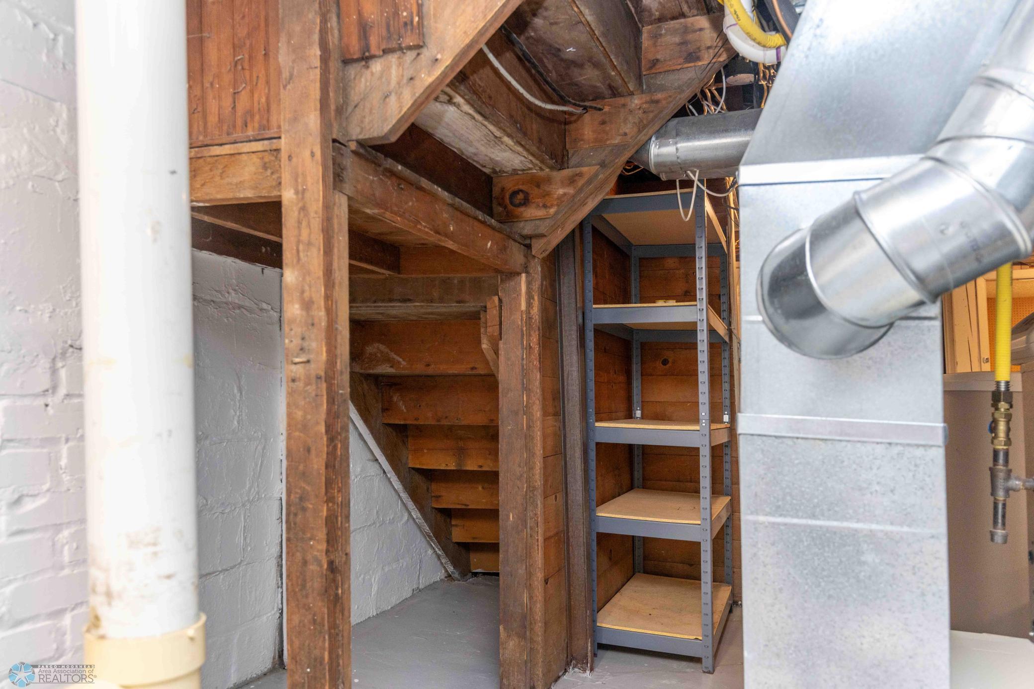 Storage shelf next to stairs included.