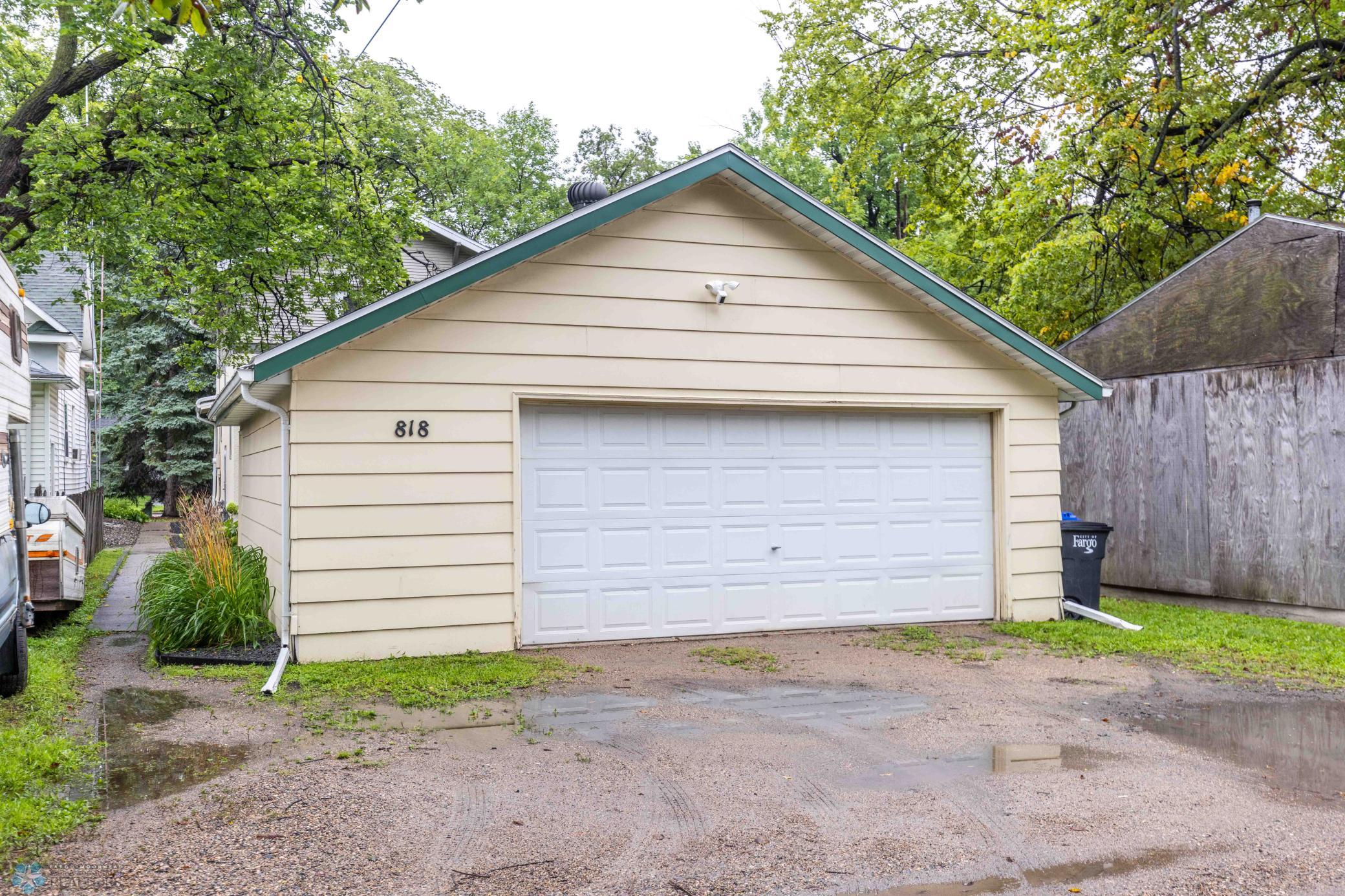 Back alley access for garage and area to store garbage cans.