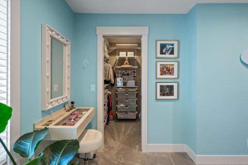Exceptional walk in closet with custom Elfa closet organizers