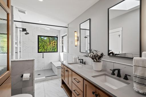 Double vanity sinks and even more natural light coming from the above skylight