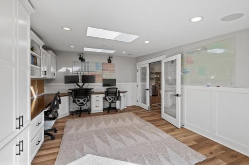 Three work spaces and all the cabinetry needed to stay organized and productive