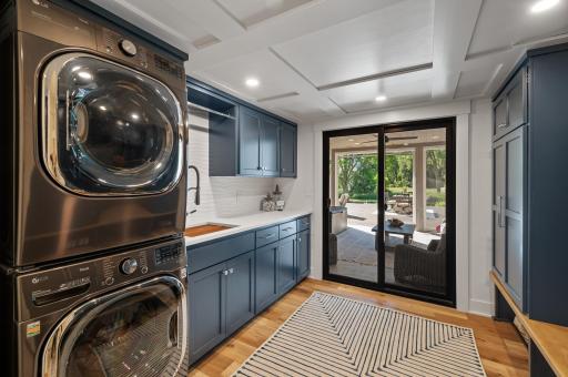 Additional cabinet space and easy access to the stacked washer and dryer right of the lake