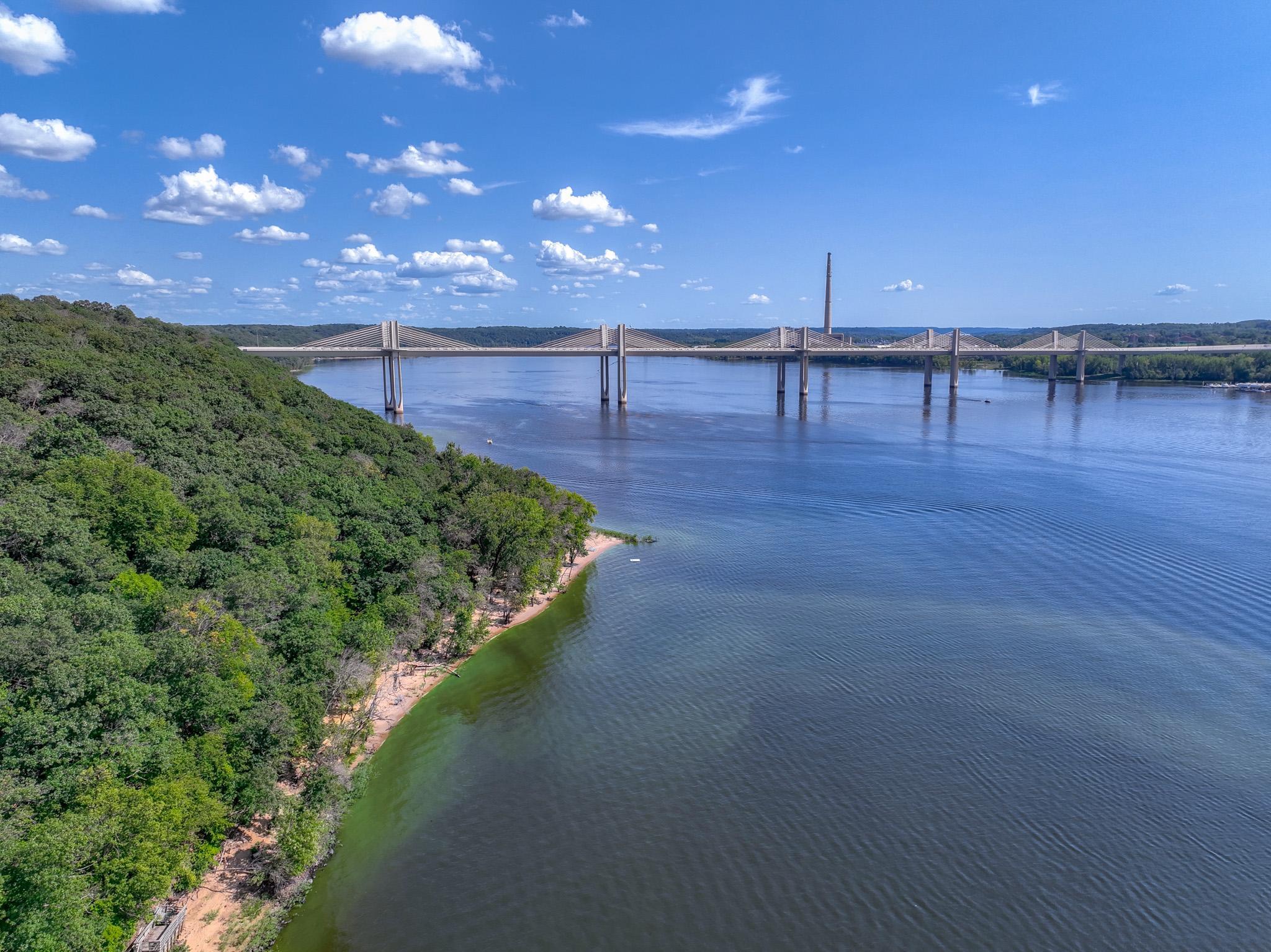 The lower left corner shows the trams deck, your property line is still further south by approx. 100', note the point mid image with the swim raft visible off the point, the point keeps passing boats far off the swimming area.