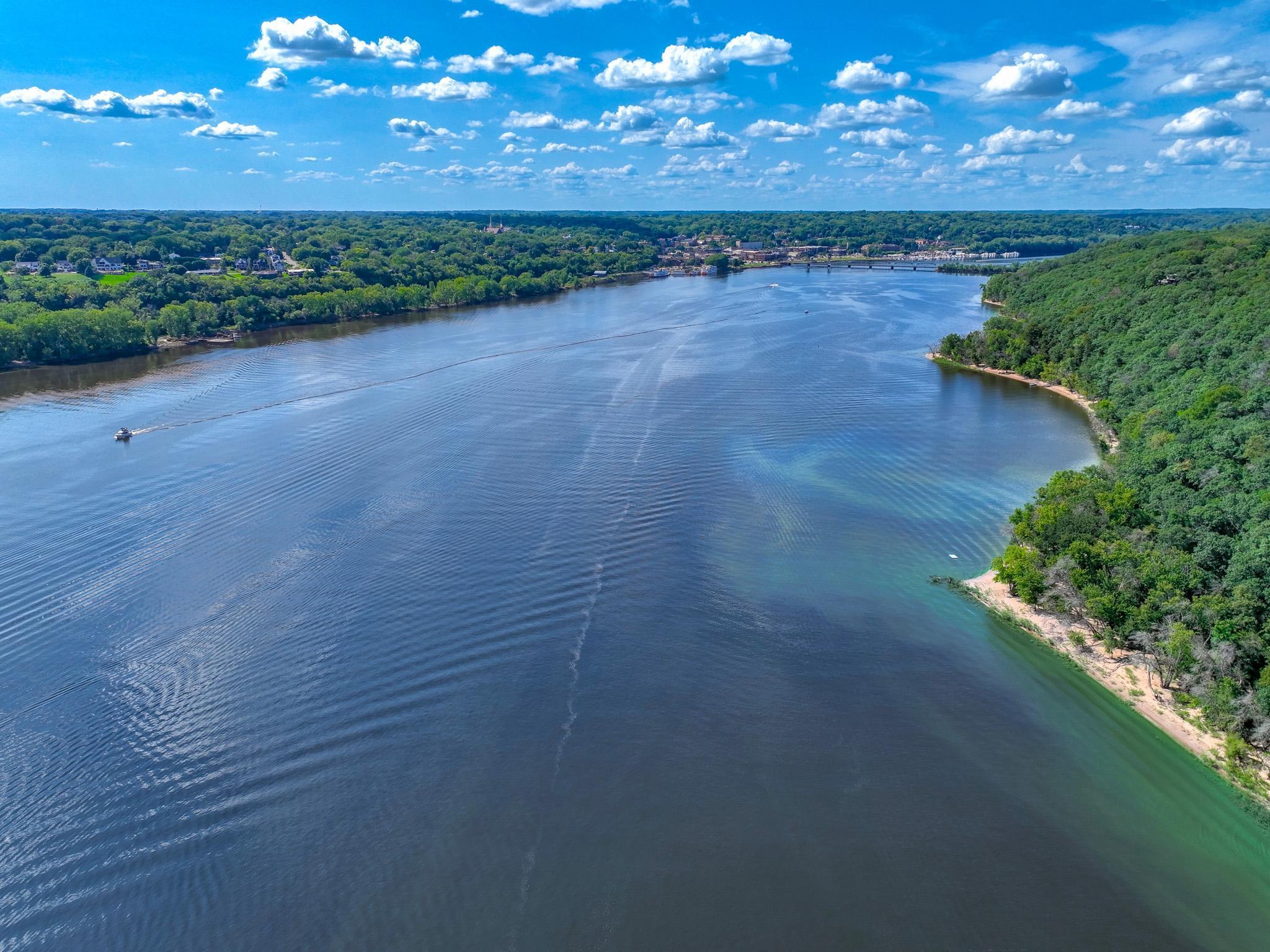 An eagle nests is just north of your beach, this is their view on approach! Important fact: The St. Croix is a designated Wild & Scenic River, a benefit to protect your investment. Note the white speck N of point, that's the swim raft off the beach