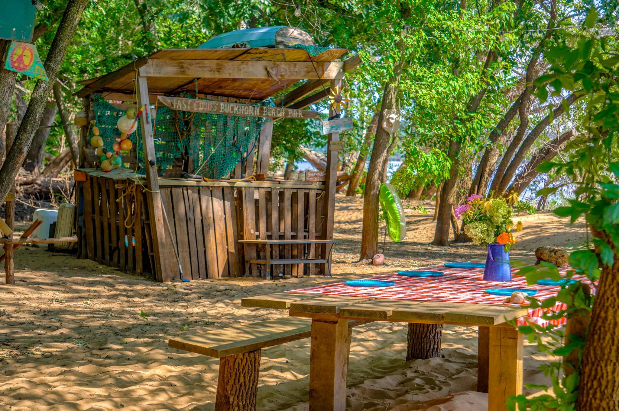Beach bar built in the Caribbean style of "chillaxin!" This is where you store yard tools, fishing poles, etc...besides a cooler full of ice!