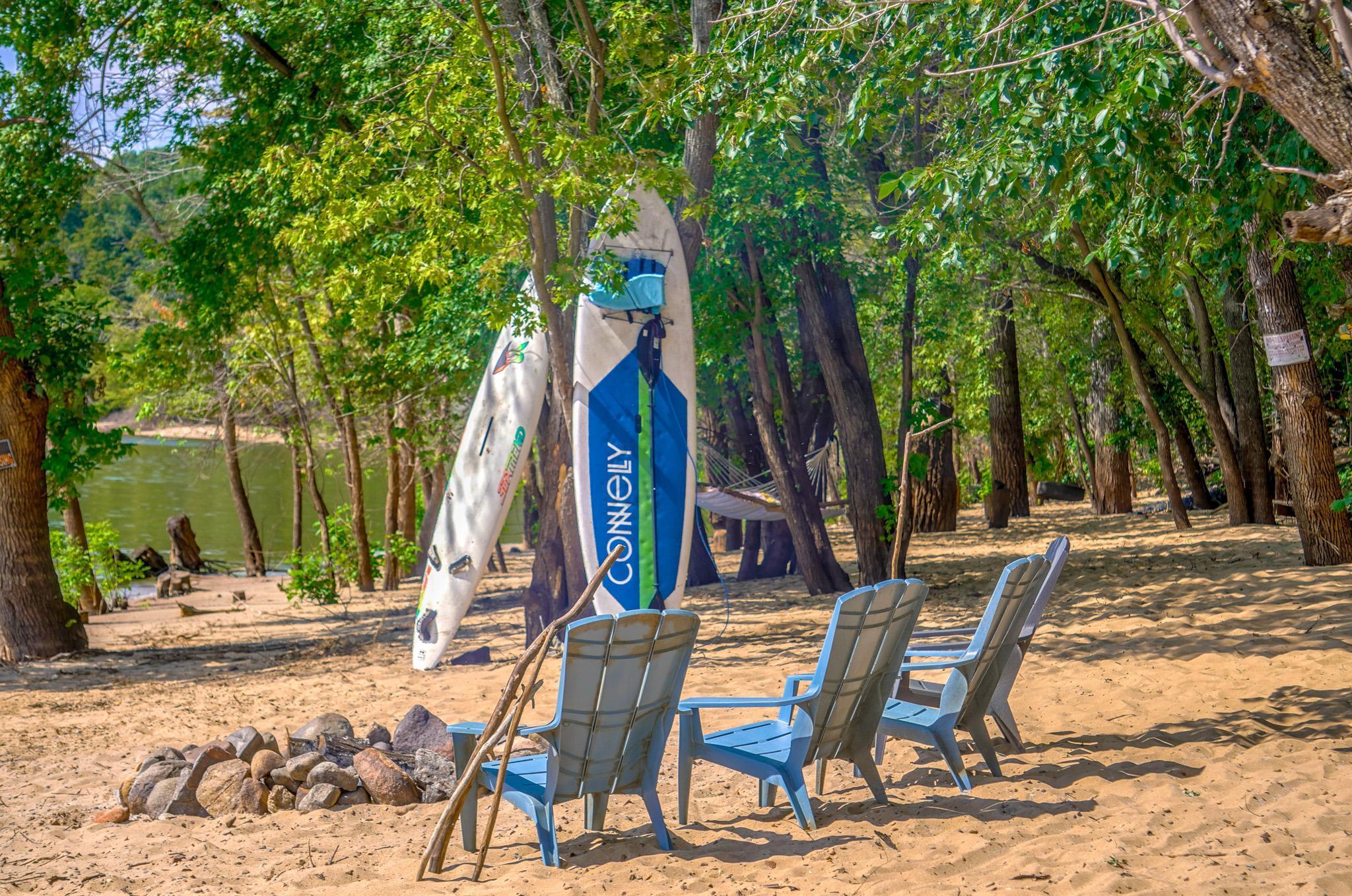 Paddleboards ready to go! Huge fire-pit away from the trees equals fires big enough for lots of S'Mores... sticks included!