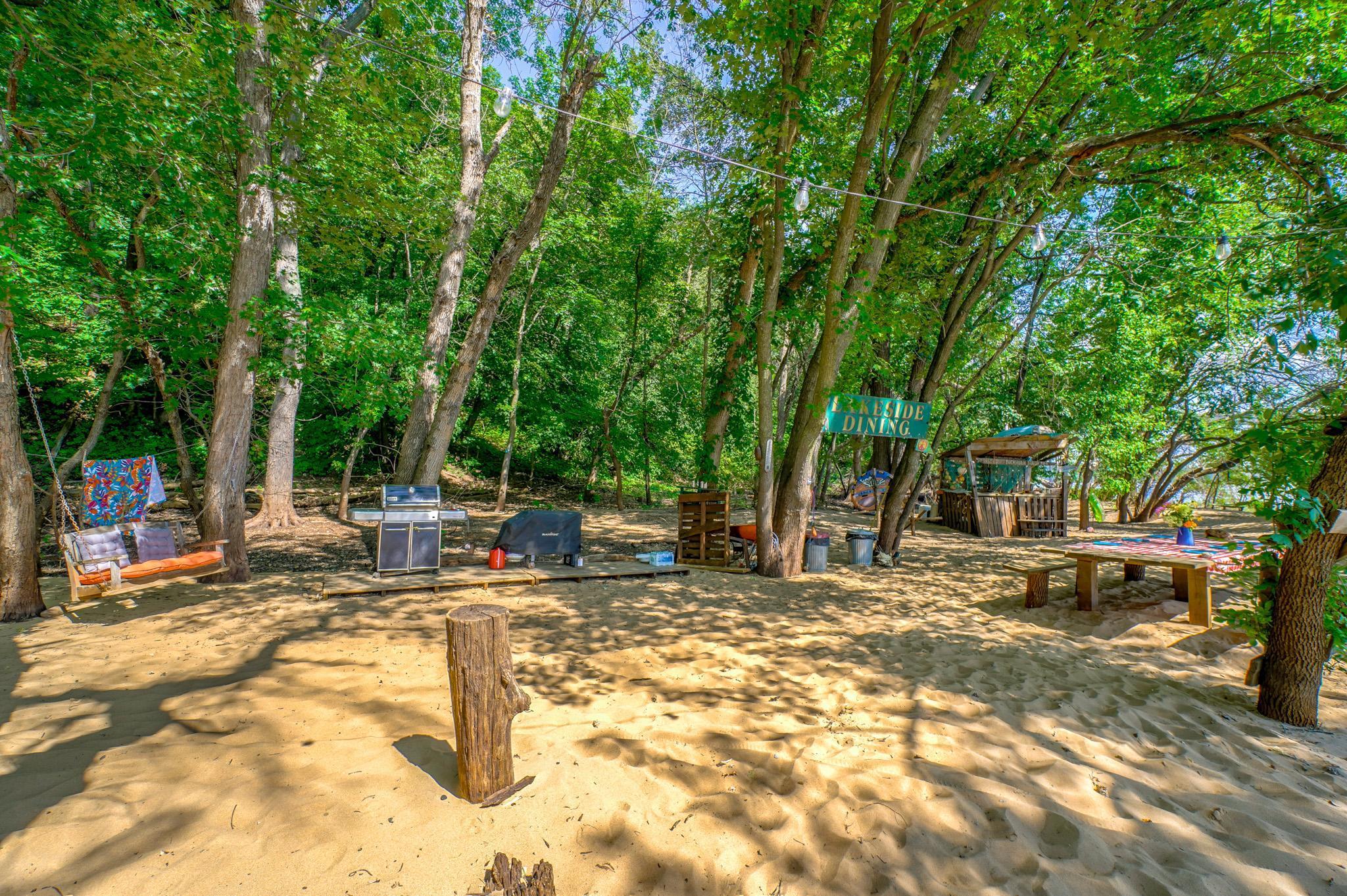 If this were a house, we would call this your Great Room...eating area, cooking station, stop by the bar to make a drink, relax in the swing... just a GREAT area to congregate!