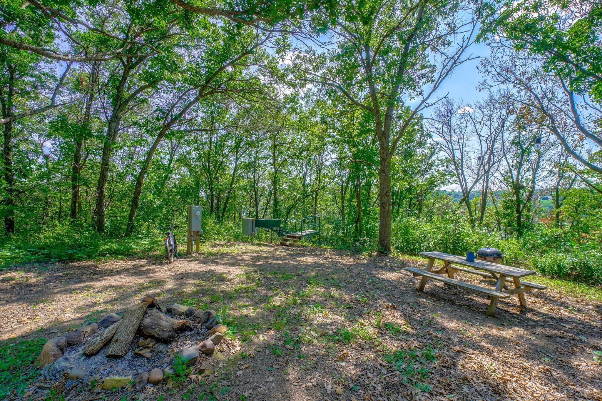 Top of the lift winter gathering spot to enjoy after snowshoeing and xc skiing, sit around the bonfire with a mug of hot cocoa, and enjoy the view of the frosty St Croix below (see the MN bluff through the trees)