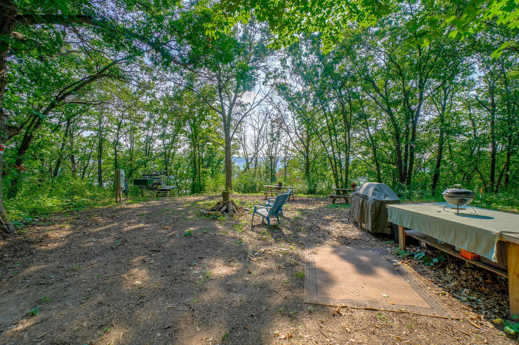 Winter gathering spot around the fire after xc skiing or snow-shoeing, cozy up around the bonfire with a mug of hot cocoa while viewing the frosty St. Croix River below. See the bluffs of MN thru the trees?
