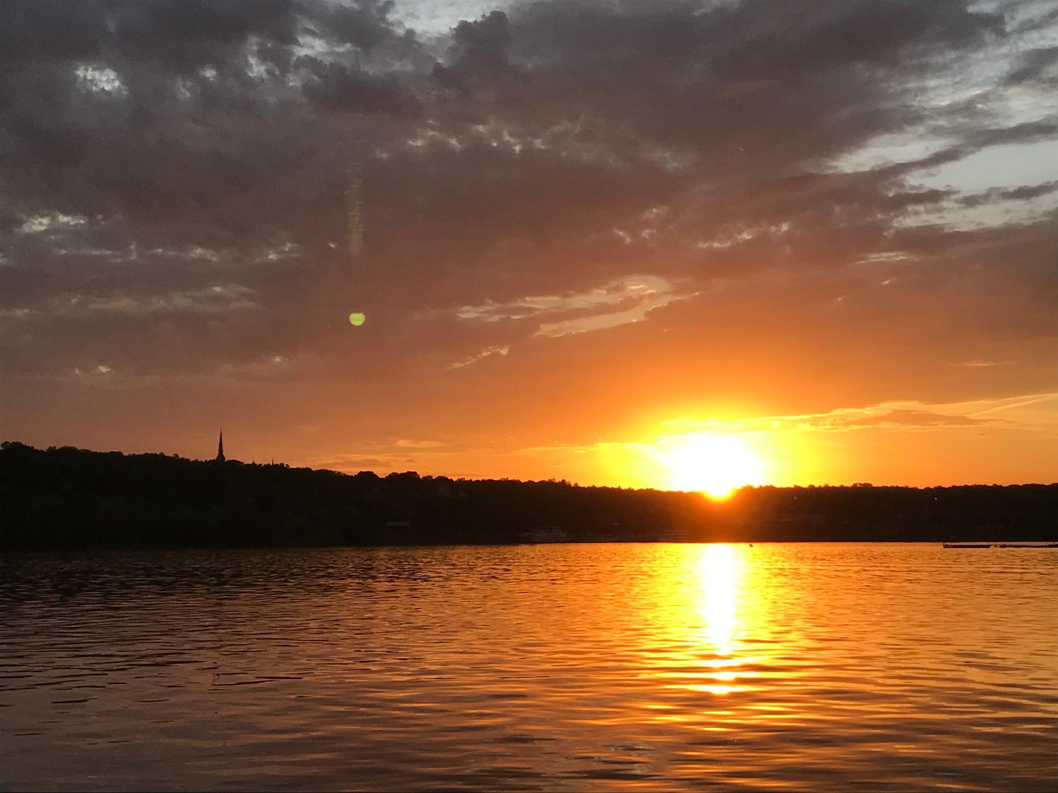 The steeples of Stillwater, a rising moon and a sunset over the magnificent St. Croix River
