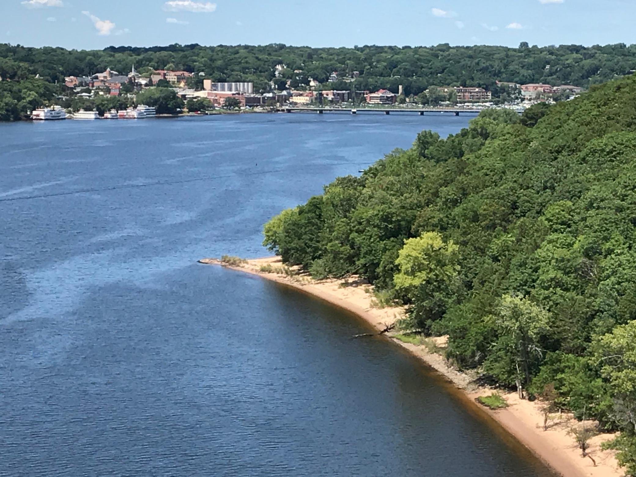 Photo taken from the lookout on the new bridge with telephoto shows the point and sandy beach in the lower right corner of photo