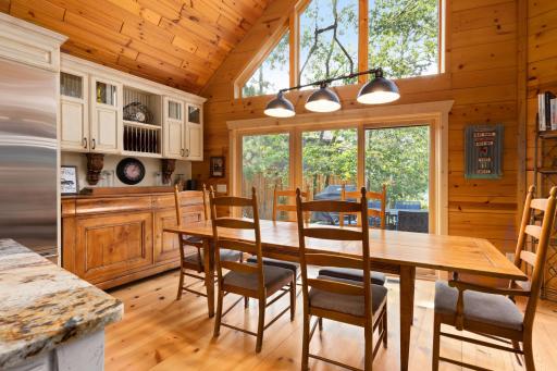 Dining Area with Patio Doors to the Deck and Lake