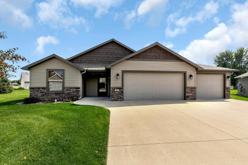 Photo for 165 Glenview Loop, Saint Cloud, MN 56303 - listing #6588610 Beautiful patio home featuring vinyl siding with stone and shaker accents. Recessed lighting in the soffit over the covered front entrance. Three stall attached garage with floor drain and nook area on backside for workshop area.