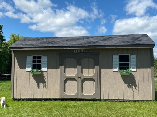 This Garden Shed with it's Windows and Flower Boxes Measures 20 x 10 Feet, has an 8 ft Ceiling and is Nicer Than Rooms in Some Homes!