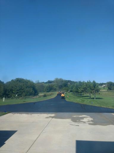 Over 700 Feet of Asphalt Driveway Leads to the Concrete Apron of the 3-Car Garage. The Pad for that Future Shop/Outbuilding with Underground Electrical is Immediately at Left.